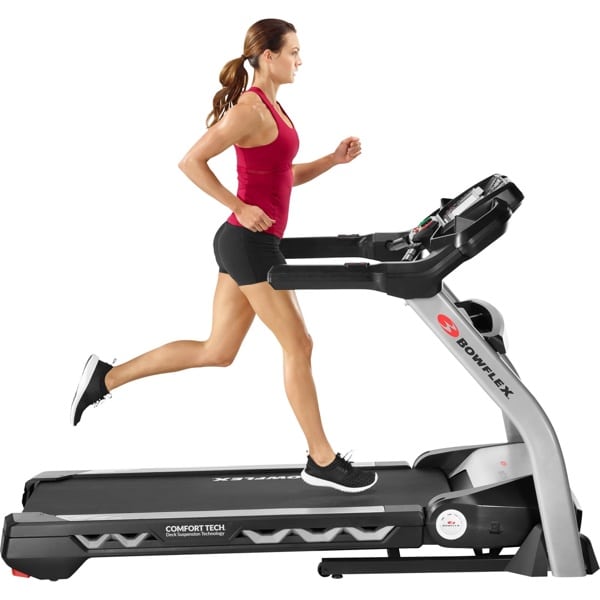 a woman runs on the bowflex treadmill