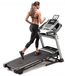A woman runs on the nordictrack c 990 treadmill