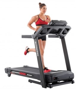 A woman runs on the schwinn 830 treadmill